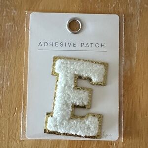 Epsilon—White and Gold Adhesive Patch